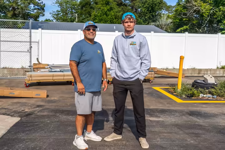 Sunscreen Digital team members standing in a local business lot